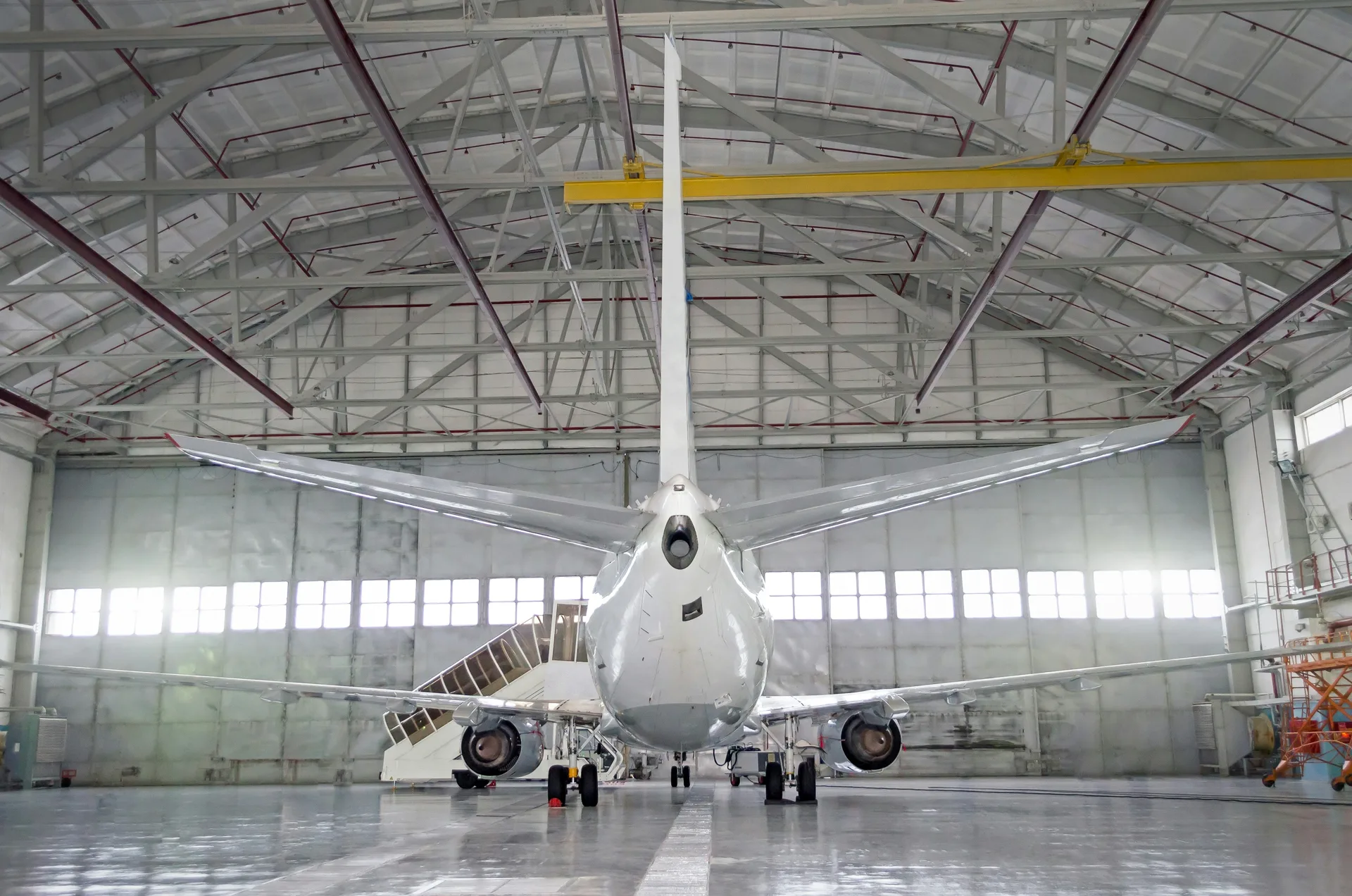 commercial jet on a finished concrete hangar floor in Regina