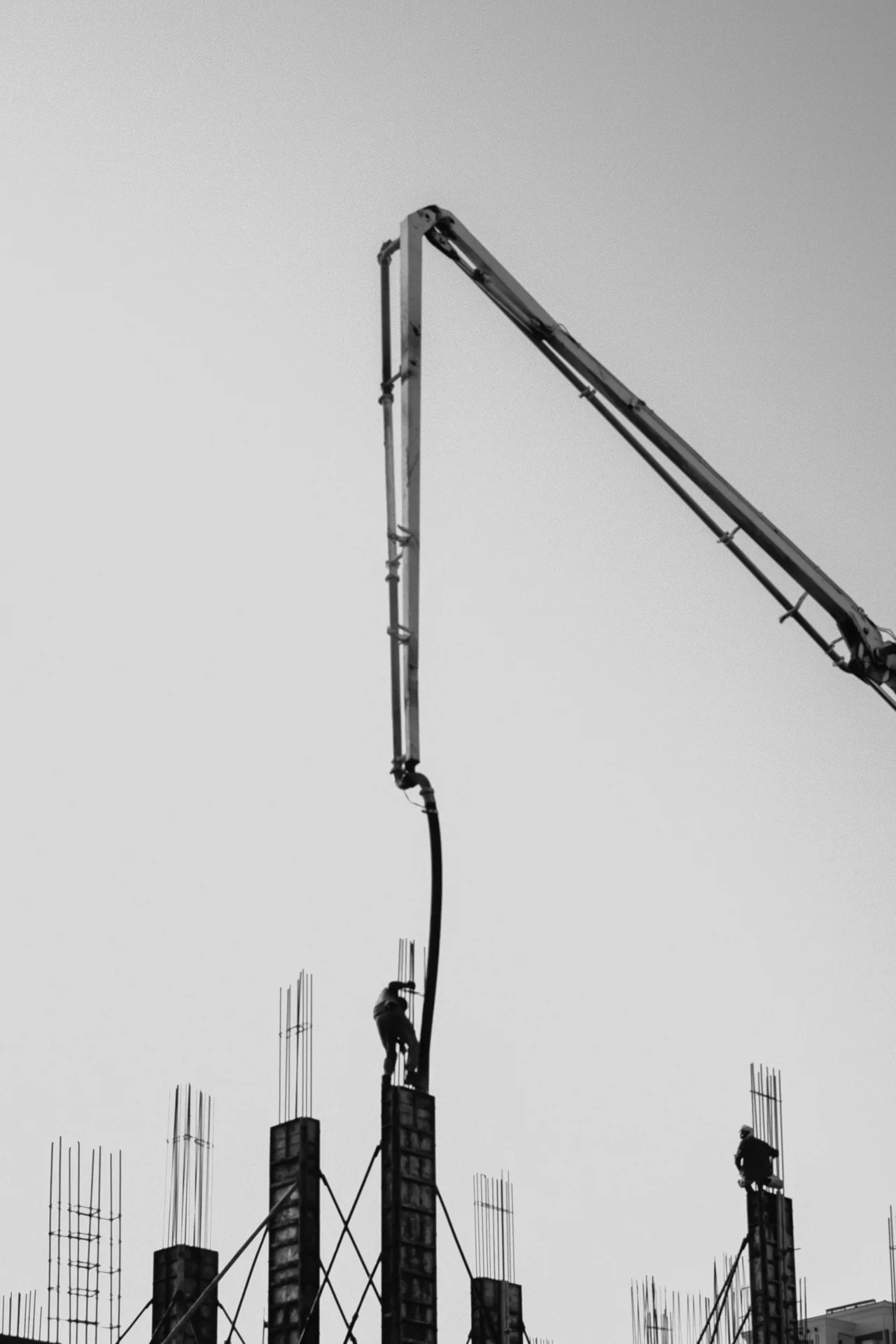 concrete pump and rebar on a tilt-up construction site in Regina