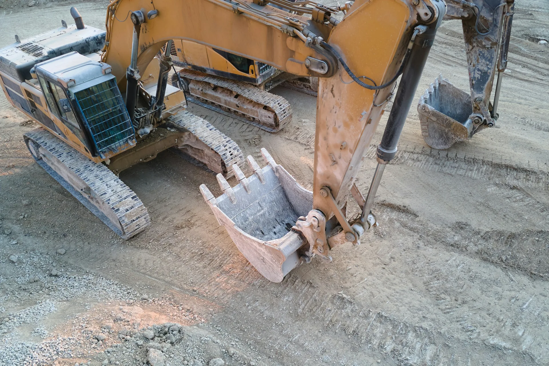 excavator working on a heavy-equipment concrete pad in Regina