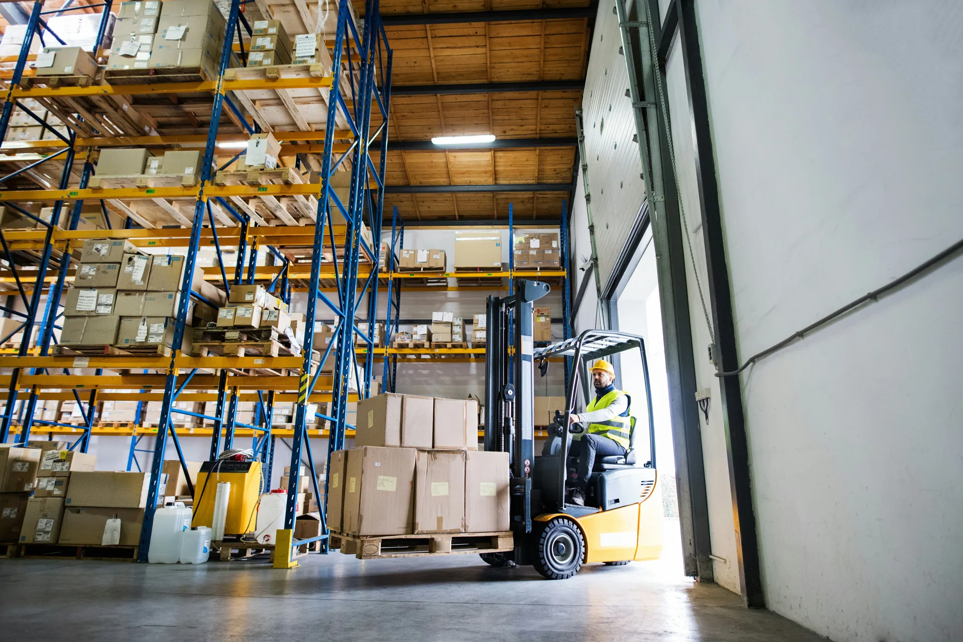 forklift on a finished industrial warehouse floor in a Regina facility