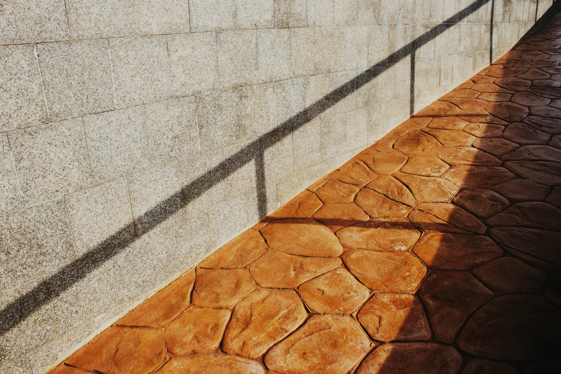 decorative stamped concrete flagstone walkway at a Regina home