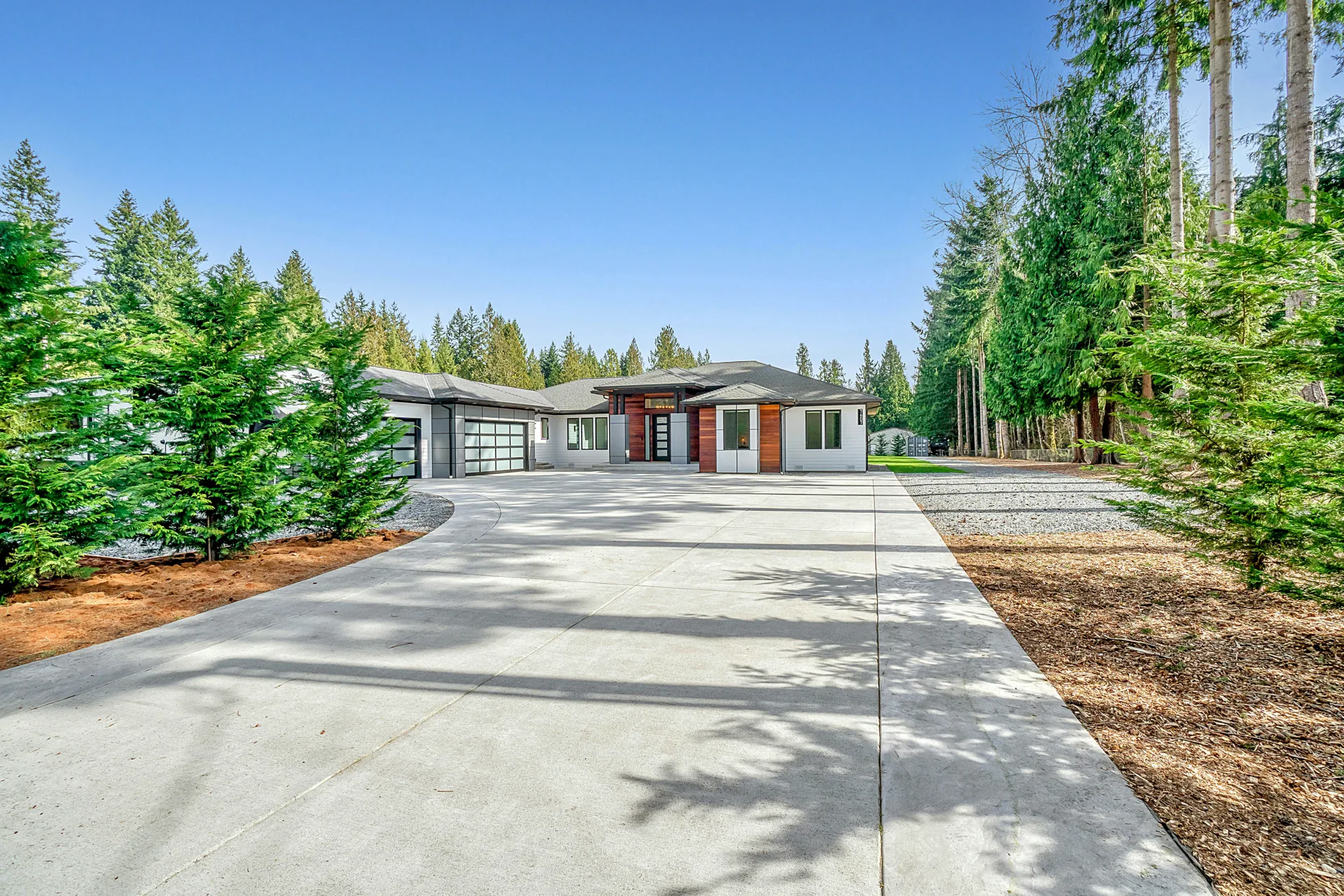 long coloured concrete driveway at a Regina home