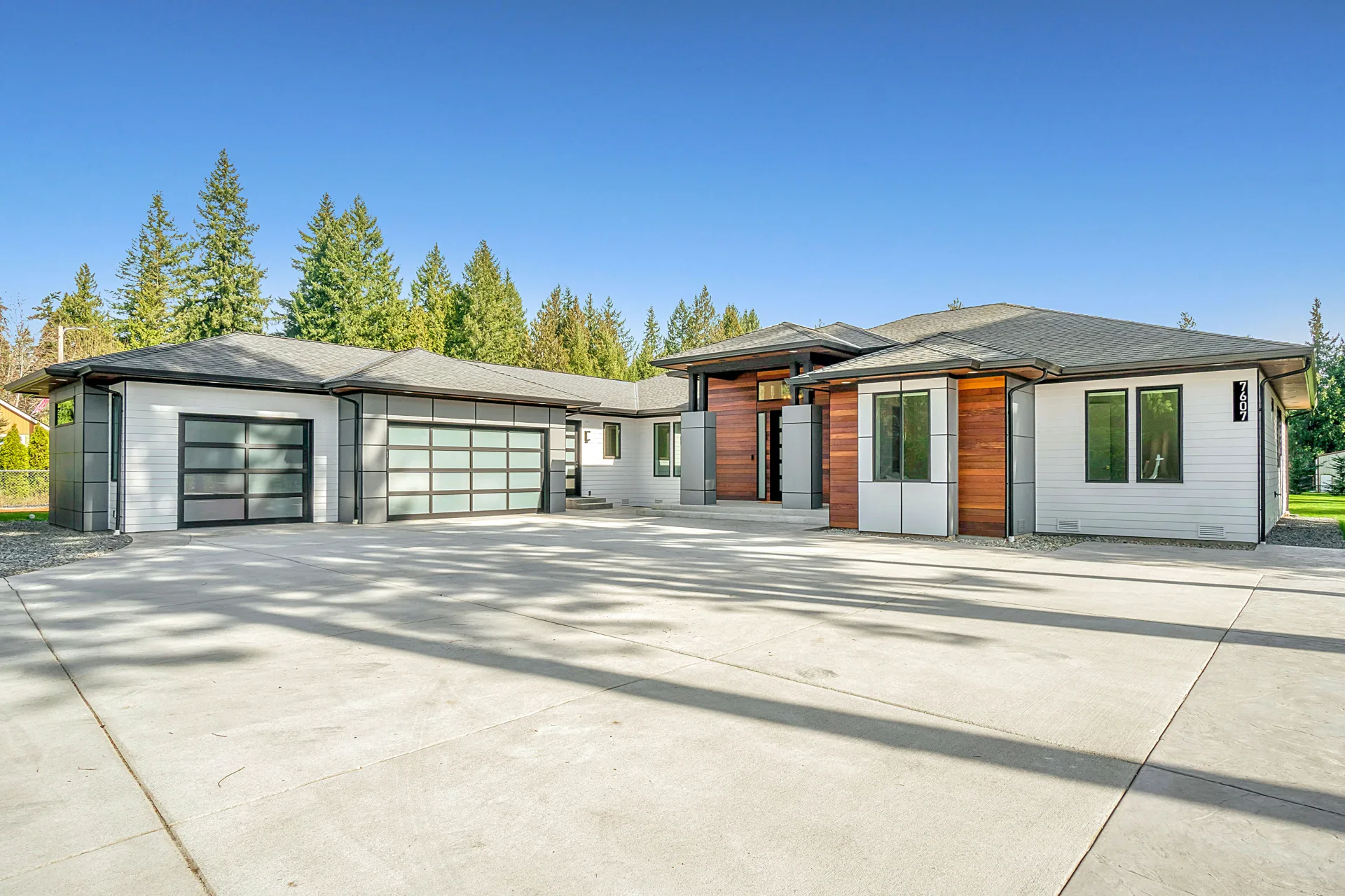 new concrete driveway at a modern three-car-garage Regina home