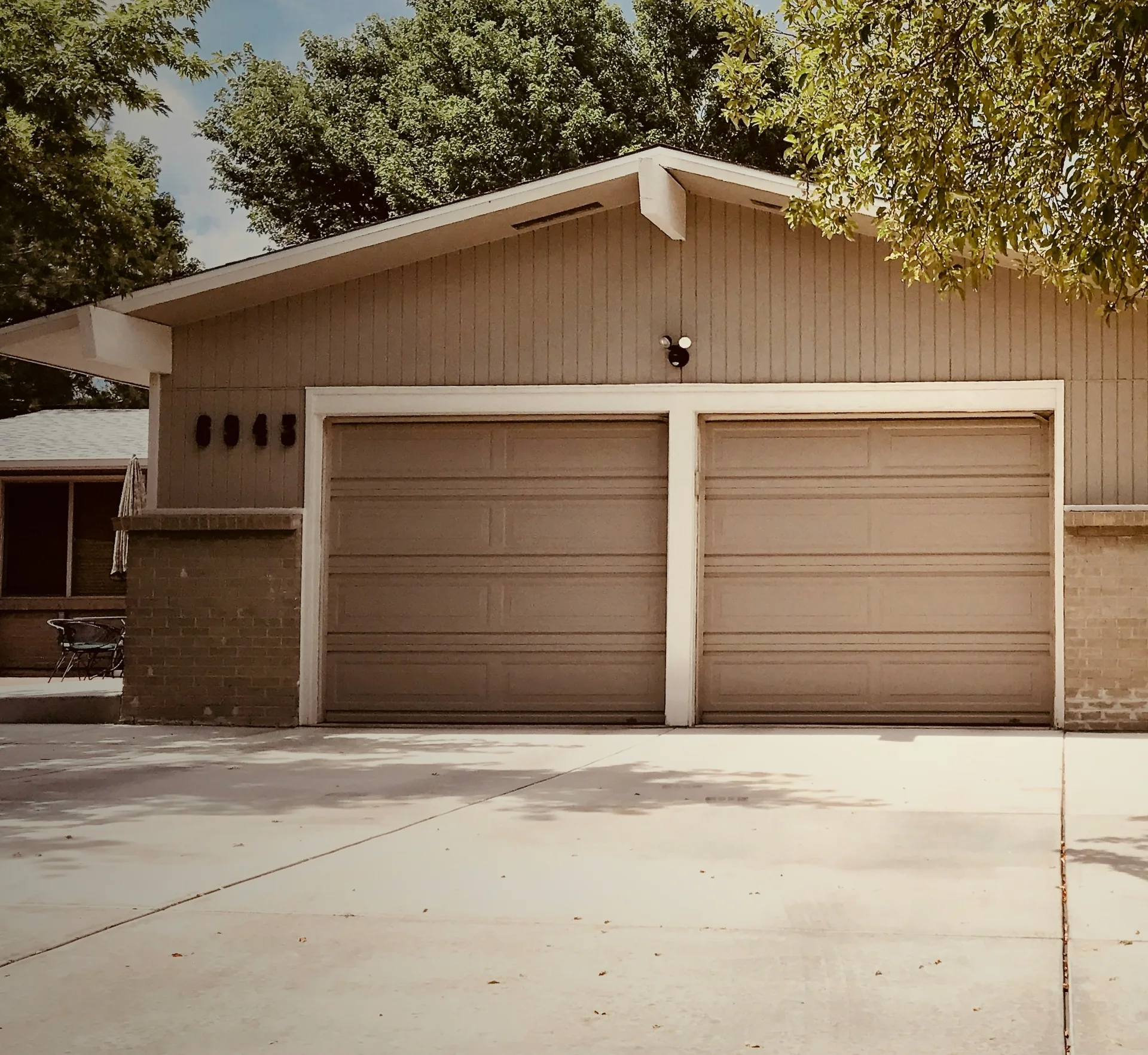 concrete driveway at a ranch home with a double garage in Regina