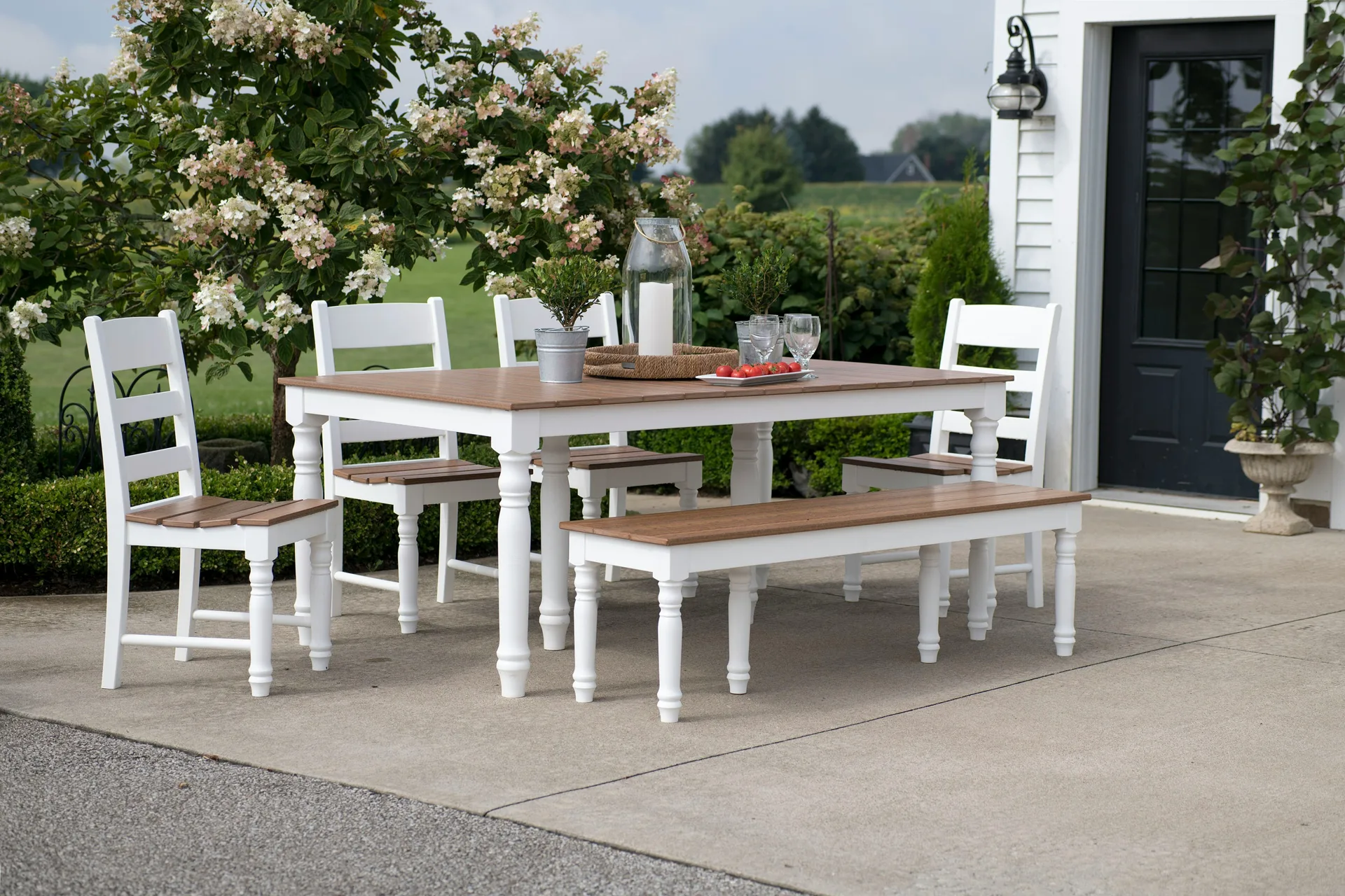 concrete patio with a dining table at a Regina farmhouse