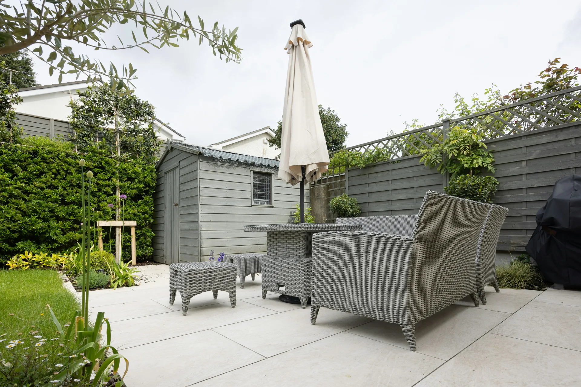 plain concrete patio in a Regina garden setting
