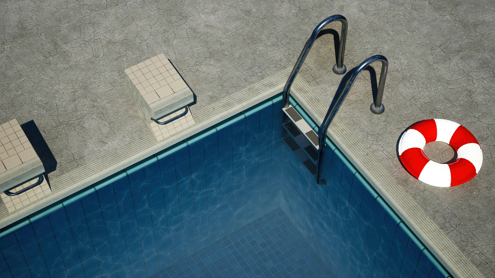 concrete pool deck with starting blocks at a Regina home
