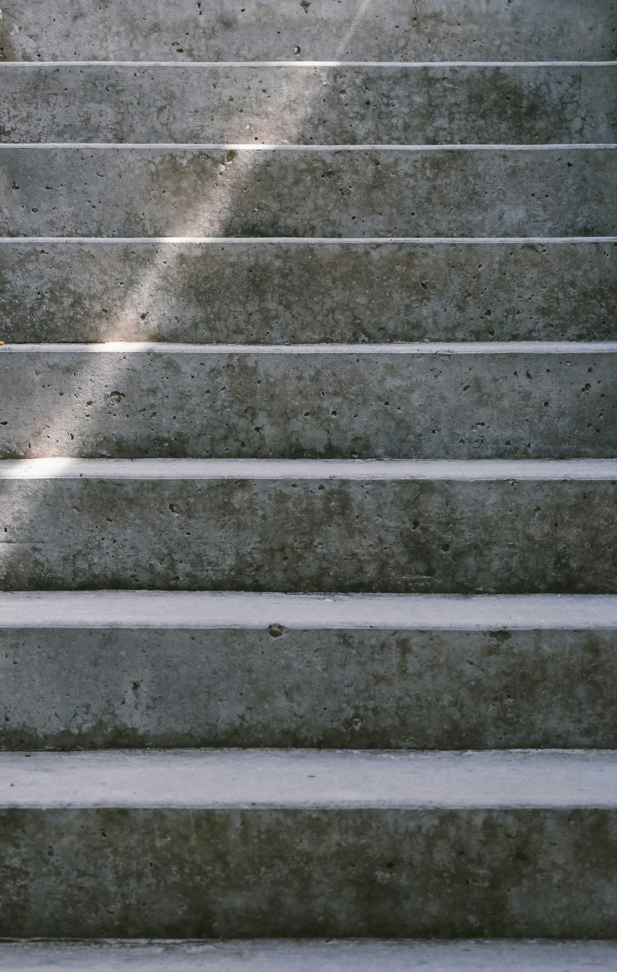 textured concrete entry steps at a Regina home