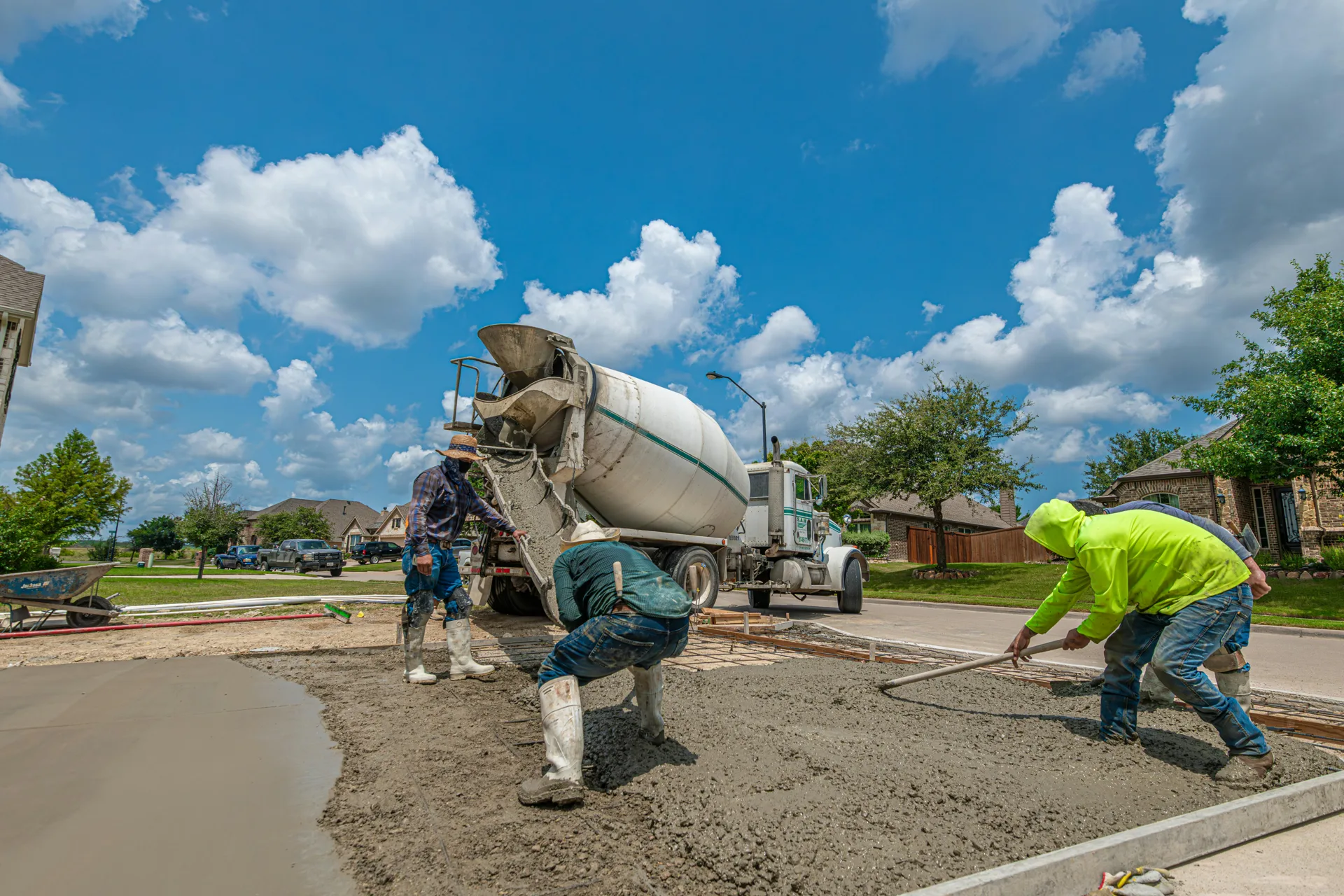 Regina concrete crew finishing a fresh driveway pour