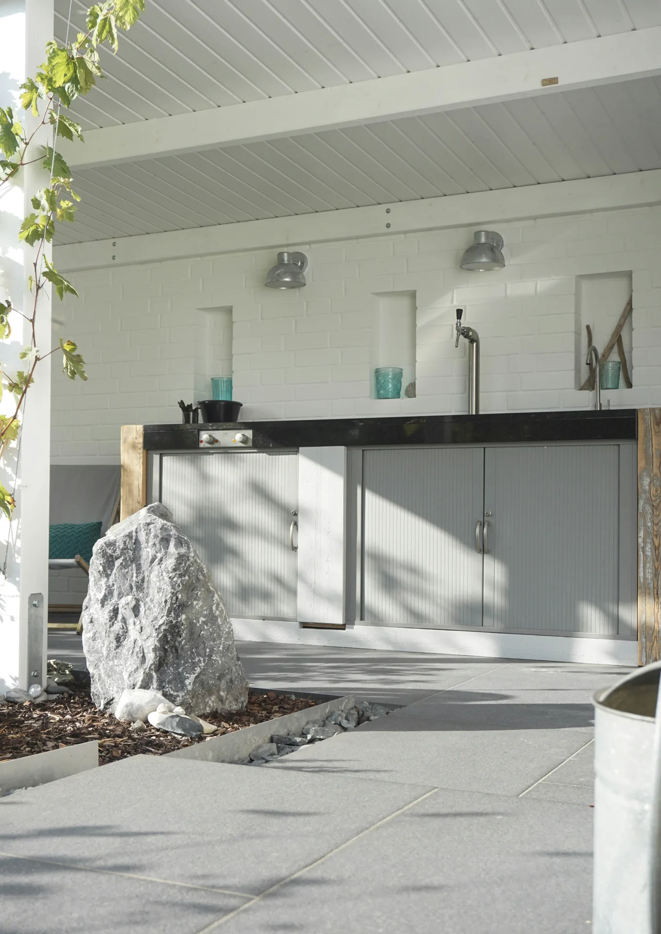 polished concrete outdoor bar counter at a Regina home