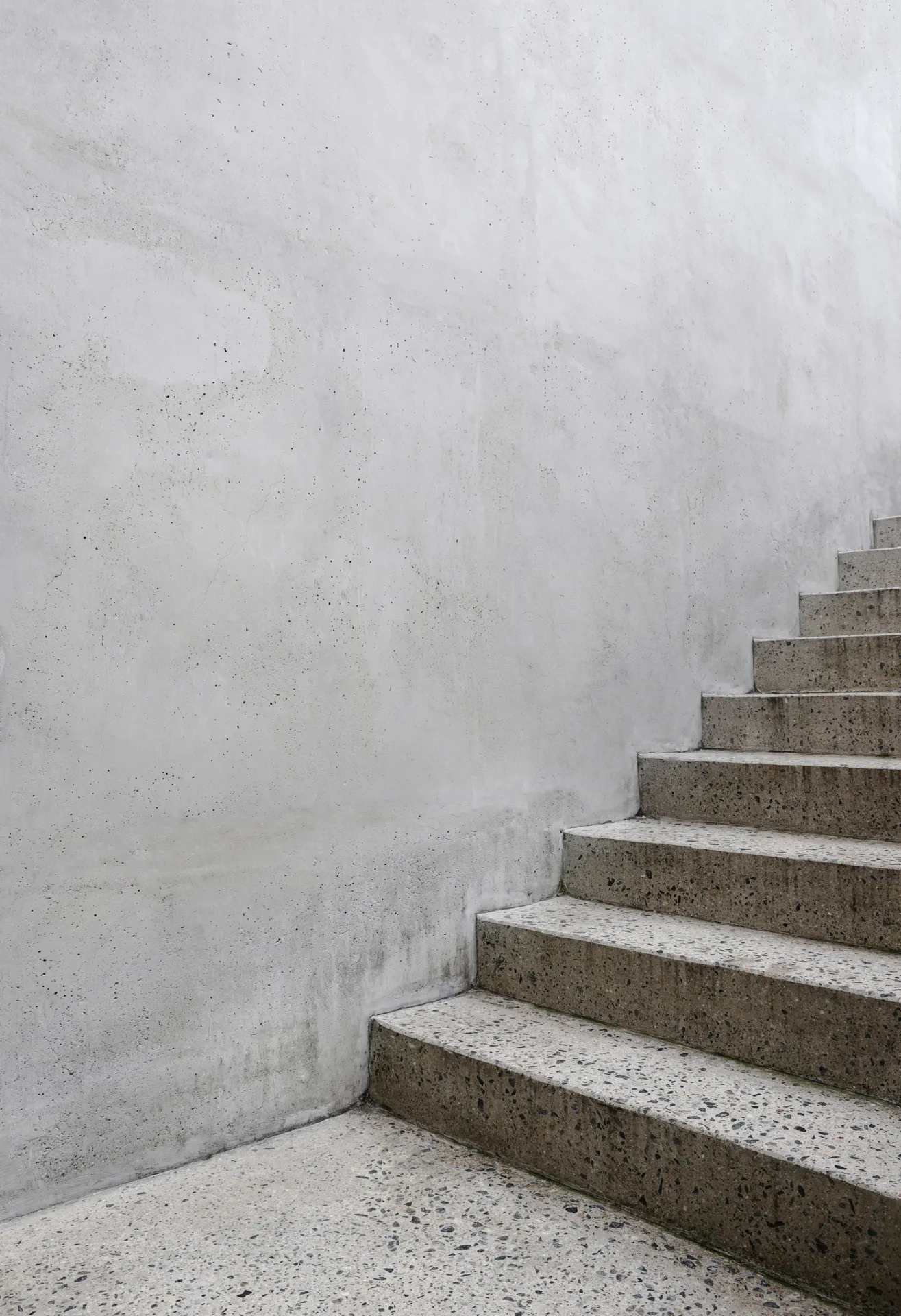 finished concrete front entry steps at a Regina home in winter
